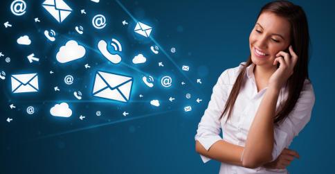 Young lady standing and making phone call with message icons